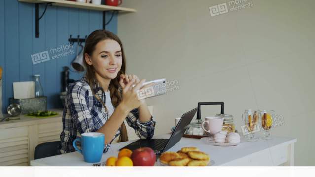 me11137194-cheerful-smiling-woamn-talking-online-video-chat-using-russia-4k-a0129